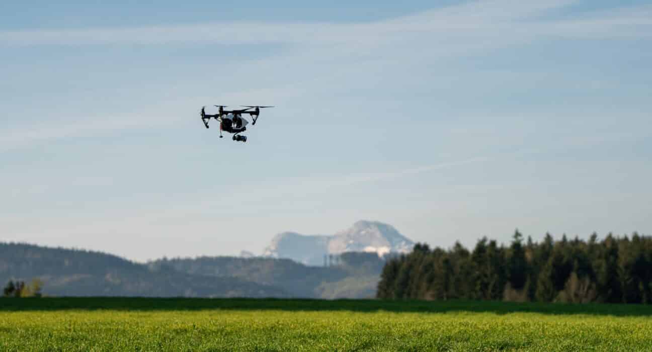 drone working in fields - technology in agriculture