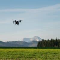 drone working in fields - technology in agriculture