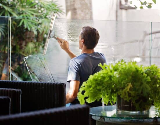 man cleaning the window - top 5 cleaning ideas