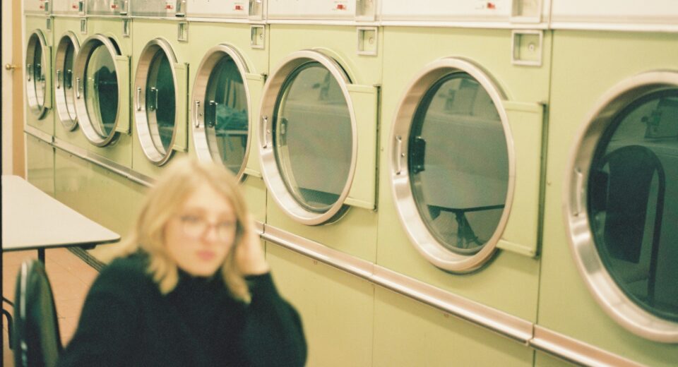 woman in laundry - what is automatic washing machine