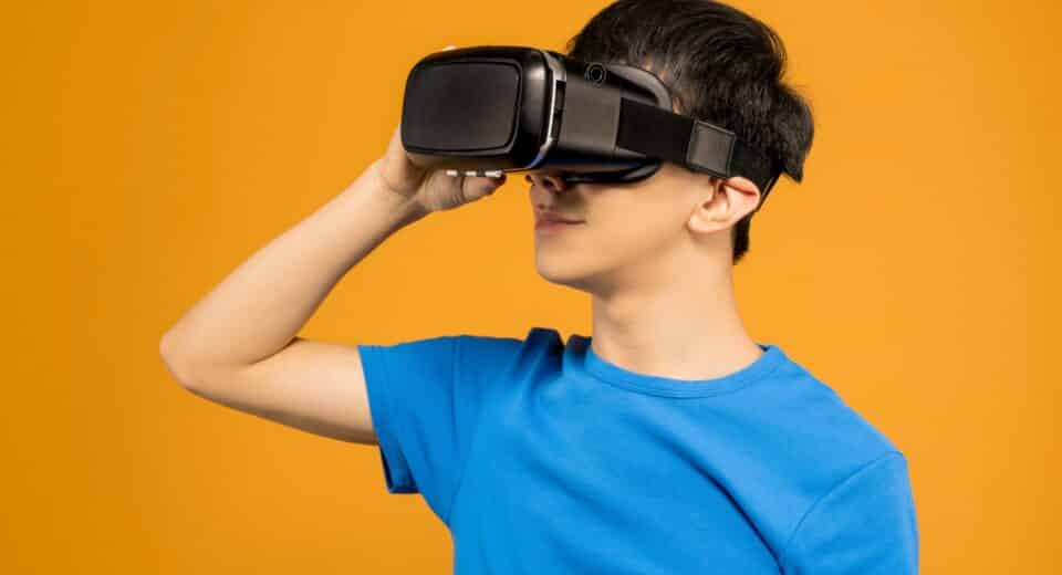 boy using vr glasses to view online church